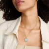 Pisces Sutton Zodiac guldfärgat rostfritt stål halsband med grönt pärlemorhänge Pisces Sutton Zodiac guldfärgat rostfritt stål halsband med grönt pärlemorhänge